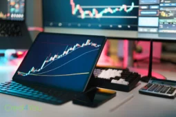 Tablet mit Kursdiagrammen symbolisiert moderne Blockchain-Anwendungen und technologische Innovation jenseits von Kryptowährungen.